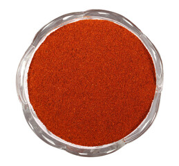 Obraz na płótnie Canvas Pile of red paprika powder, Cayenne pepper in glass bowl isolated on white, top view