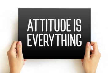 Attitude Is Everything text on card, concept background