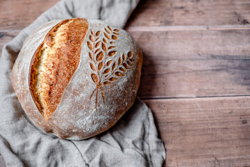 Rustic Italian Bread with Lievito Madre on a wooden table. Organic and healthy bread on sourdough 