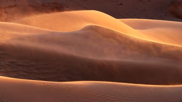 Sand blowing over dunes in wind, sandstorm in Gobi desert, Mongolia