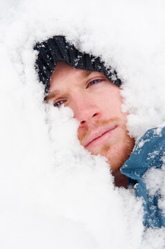 A 22 year old man lies in the snow up Milcreek Canyon, near Salt Lake City, Utah.