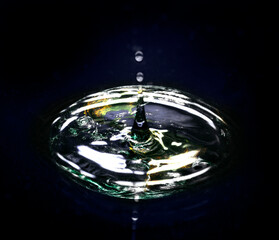 A conceptual image of the earth seen through a drop of water illustrating the fragile state of the world.