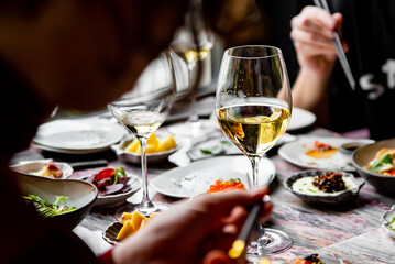 glass with wine and wine snack set, food from spain, cheese, meat, vegetables and other appetizers...