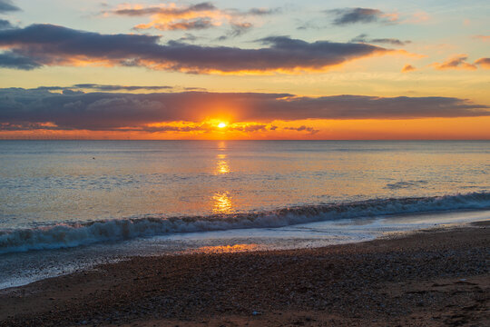 The sunsetting over the English Channel viewed from Brighton Beach, UK © Pablo L Mendoza