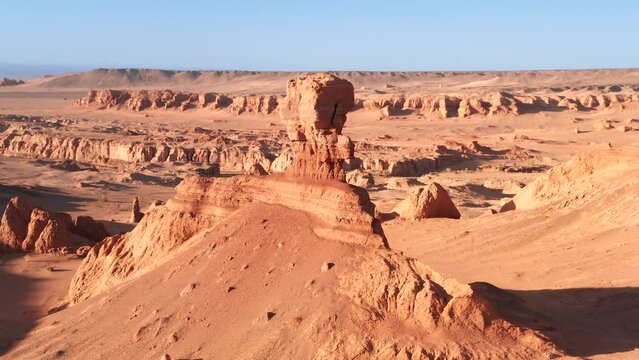 Cinematic aerial flyover of sphinx rock in desert Gobi, Khermen tsav canyon