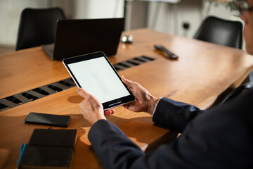 Close up of man using digital tablet