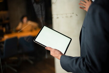 Close up of man using digital tablet