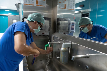 The doctor is preparing for surgery. Doctor sterilizing by washing hands before surgery