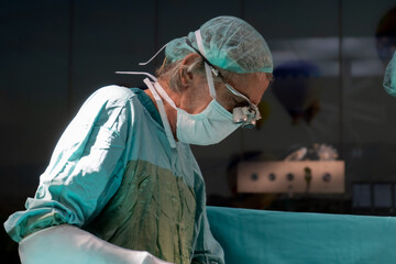 Open heart surgery, doctors and cardiologists perform open heart surgery. Doctors in green uniforms...