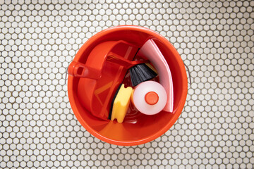 Cleaning products on a tiled surface. Top view, flat lay © Alex