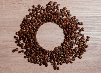 Circle made with coffee beans. Background to put text in the center. Template. copy space