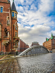 Fototapeta na wymiar historic Red Brick Buildings and cobblestone streets of Hamburg, Germany