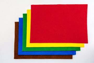 A set of sheets of multicolored felt for needlework. Natural felt texture
