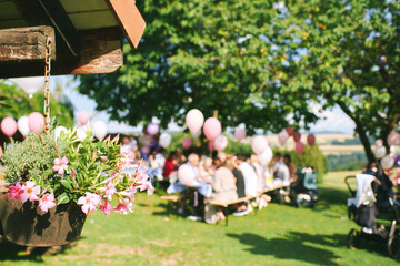Blurred background of summer garden party, rural birthday or wedding celebration - 565328291