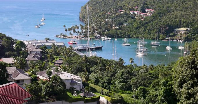 St Lucia Caribbean Marigot Bay boats village yacht. British Commonwealth Island. National Marine Reserve. Cruise ship vacation destination. Yacht sailboat harbor and marina.