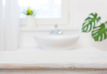Fototapeta na wymiar Bathroom table top for product display on blurred sink background