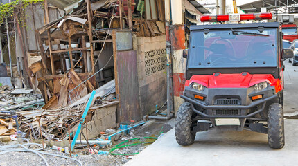red buggy next to the ruined building of the sunny city of Bangkok
