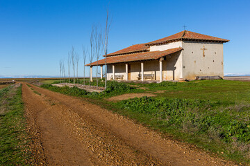 Road, Hermitage of San Cristóbal and cereal agricultural fields. Matallana de Valmadrigal, Leon,...