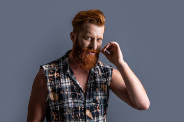 photo of mature brutal bearded guy with beard. brutal bearded guy isolated on grey.