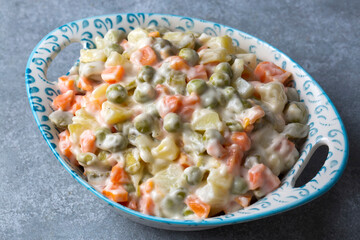 Russian salad Olivier with mayonnaise and egg served (Turkish name; Rus salatasi)