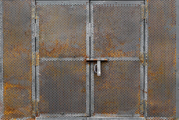 Rusted webbed metal crate with handle sliding lock