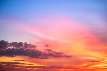 beautiful gradient orange and ranibow colour clouds and sunlight on the blue sky perfect for the background, take in everning,Twilight