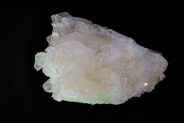 WHITE MINERAL APOPHYLLITE ON A DARK BACKGROUND