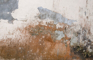 Decaying white concrete wall with rust stains. Background texture