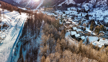 Panoramic view of Bardonecchia village from above, ski resort in the italian western Alps, Piedmont, Italy. Bardonecchia, Italy - January 2023