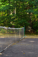 Old tennis net with holes