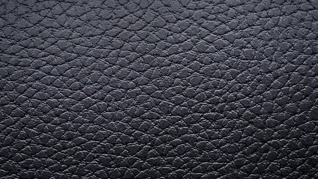 Black leather texture close up. Extreme close up footage.