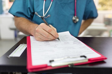 Close up shot of a medical form filled up by a health care personnel in the clinic