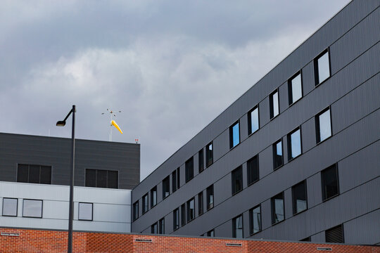 Yellow wind sock on top of hospital building in Maitland