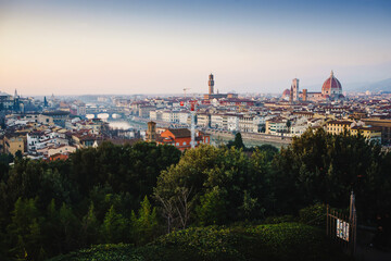 Panoramic landscape of Tuscany. Sunset. View of Florence. Silhouettes of cypresses, historical