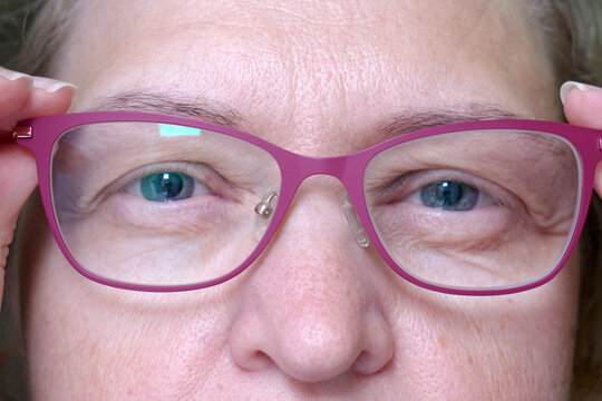 Middle-aged Woman Wearing Glasses With Pupils Dilated Of Eyes, Face Woman In Glasses, Closeup