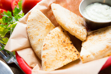 Pita bread is a type of soft, slightly fermented flatbread made from wheat flour, eaten in the Mediterranean area, especially in the Near East, occasionally baked on the walls of the oven and reminisc