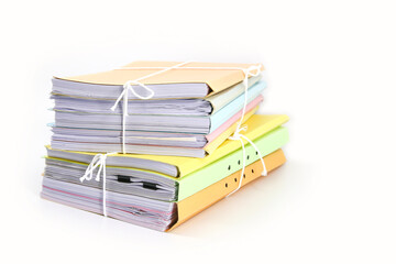 Pile or heap of financial business document paperwork stack on office desk concept of workload overtime or workplace paperless copy