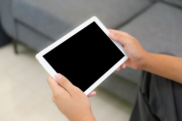 Hand holding blank screen phone or smartphone or tablet for template on white background.