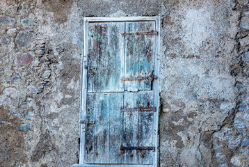old wooden door on old wall