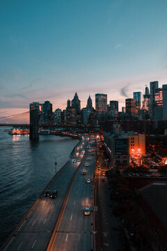 Manhattan skyline at sunset, view from Brooklyn Bridge