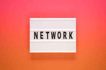 The word network on lightbox. Business concept