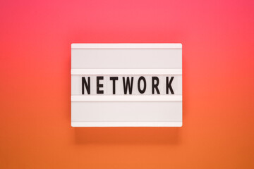 The word network on lightbox. Business concept