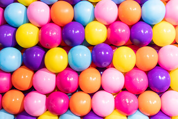 Fototapeta na wymiar Colorful balloons background - real photo, concept of celebration, party, happy, surprise.