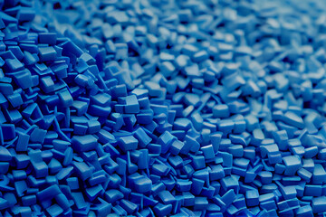 Close up of a two stacks of blue plastic polypropylene granules on a table, Generative AI