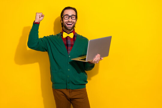 Photo of young gentleman handsome guy wear classy formal cardigan bowtie short celebrate freelancer order laptop isolated yellow color background