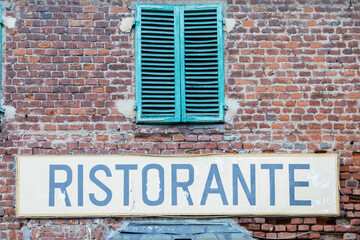 Old vintage restaurant sign in Italy - Concept of retro, traditional Ristorante design