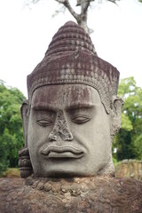 Fototapeta na wymiar angkor thom, god closeup, buddhism, tourist in asia, no nose, theft?, good and evil bridge, cambodia, temple