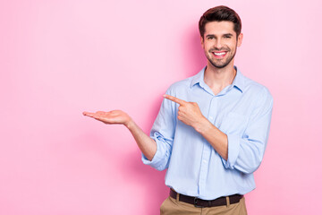 Photo of positive man arm demonstrate empty space special deal super product sale discount isolated on pink color background