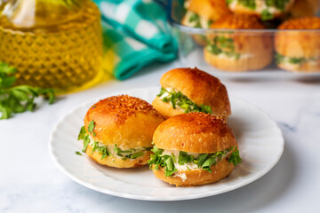 Turkish pastry filled with dill, parsley, cream cheese and cheddar cheese. Turkish name: Sakallı Pogaca or Saçaklı Pogaca