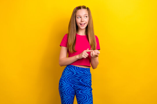 Photo of young thoughtful girl teenager stylish wearing looking empty space nonverbal counting maths numbers isolated over yellow color background